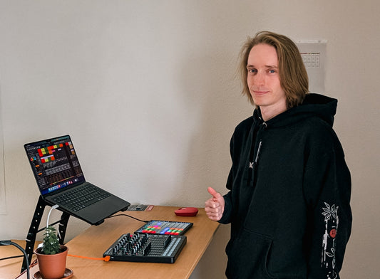 Me standing in front of my live setup for performing my music from the psytrance project "A Fool's Quest"